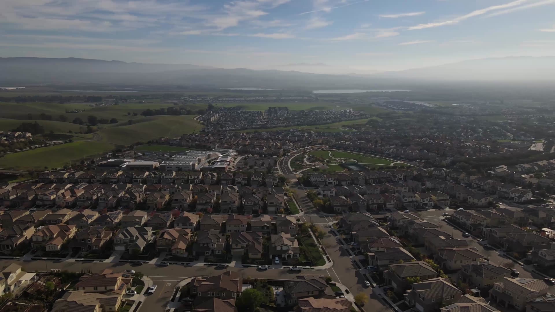 Aerial view of Bay Area neighborhoods with the hills behind